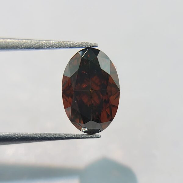 (M69) Natural Fancy Dark Orangy Brown color 0.73CT SI1 Clarity Oval Shape GIA Certified Diamond